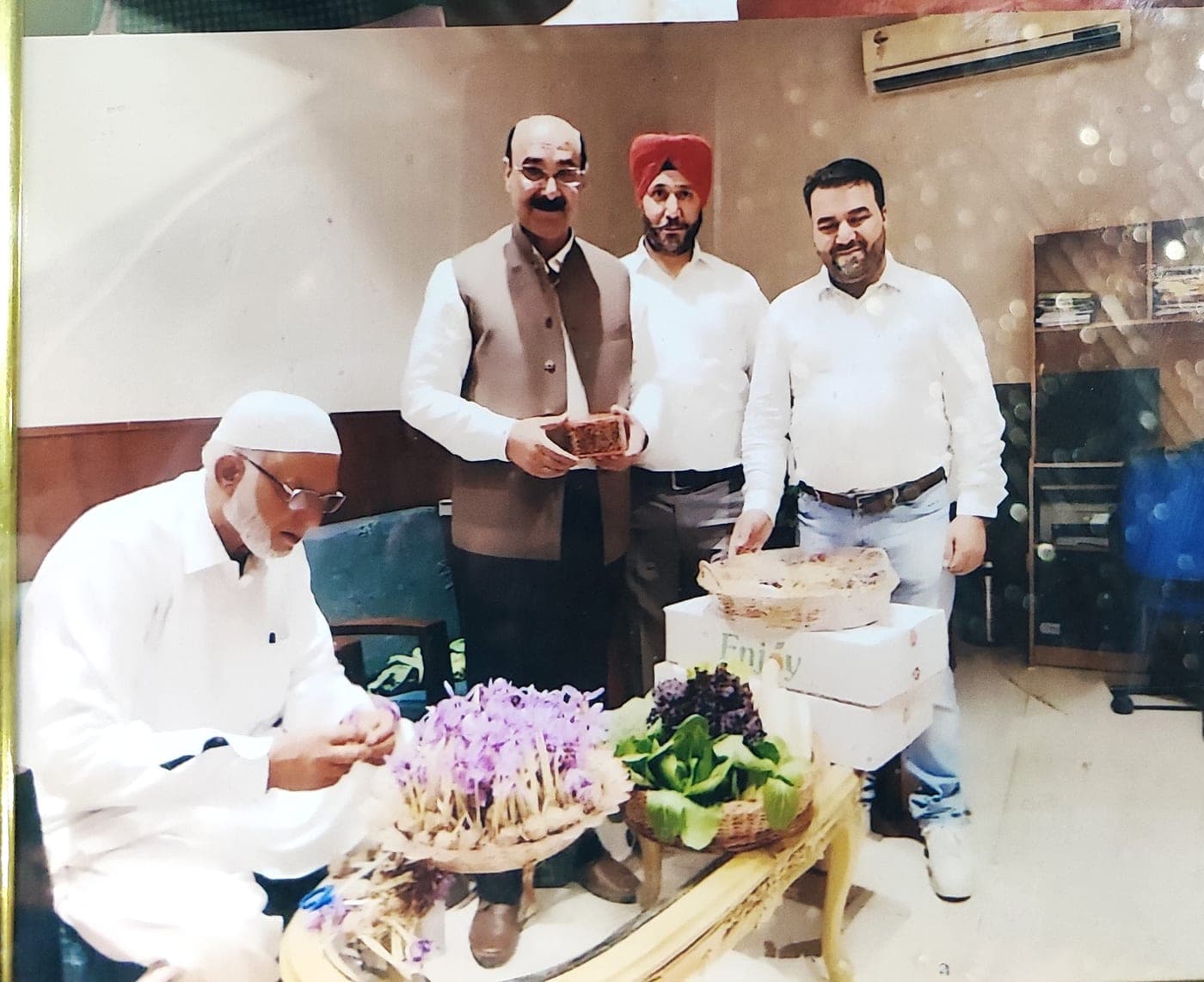 Our family elder hand-arranging the saffron flower bouquet in Pampore that was presented to the Prime Minister
