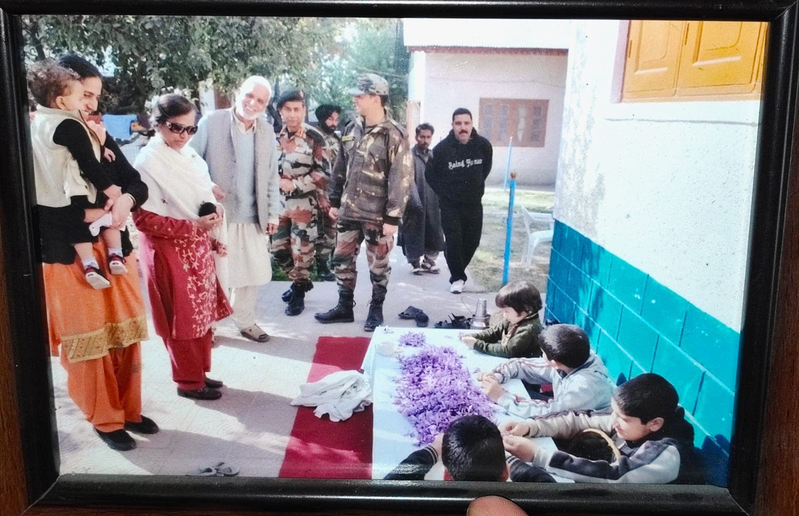 Indian Army officers and their families visiting our home during the 2019 saffron harvest to watch flower separation