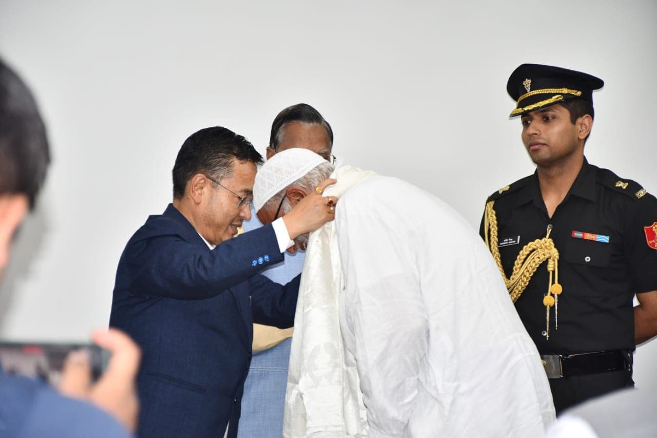 Our family elder felicitated with a traditional shawl at the Sikkim ceremony, with an Indian Army officer present