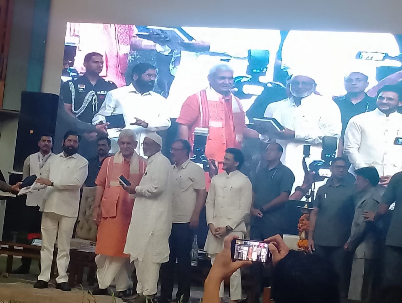 Our family elder on stage with the Lieutenant Governor of Jammu & Kashmir, Manoj Sinha, at a national felicitation event