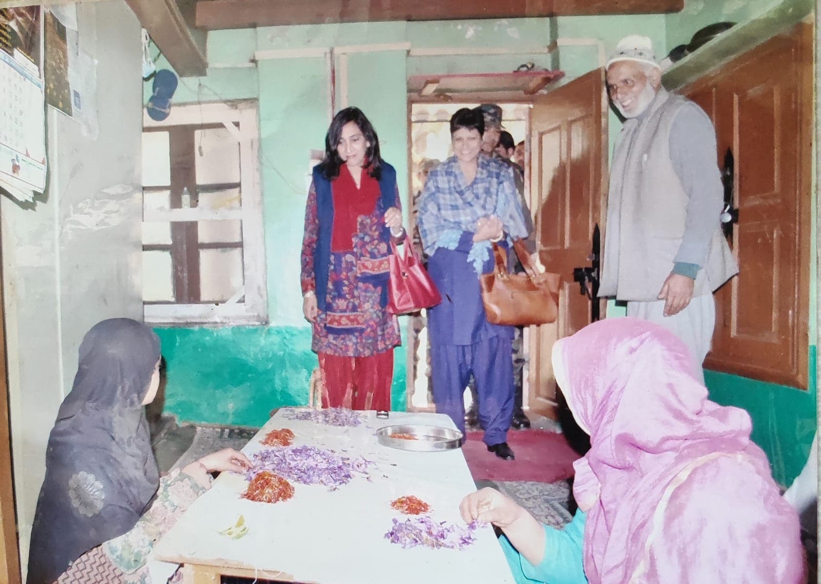 Media personnel and guests watching traditional saffron stigma separation at our family home in Pampore