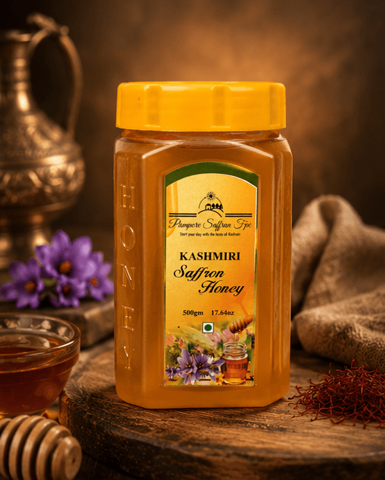 The saffron honey jar on dark wood between crocus flowers, a glass bowl of honey and a scatter of saffron threads